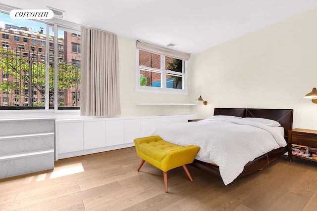213 E 71st St Unit Ph5, New York City, NY 10021 - bedroom featuring wood finished floors and multiple windows
