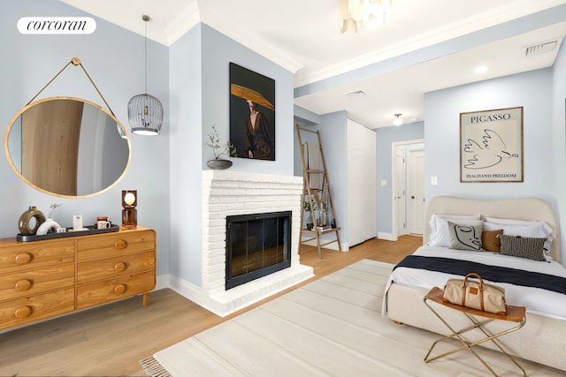 213 E 71st St Unit Ph5, New York City, NY 10021 - living area featuring wood finished floors, crown molding, baseboards, and a fireplace