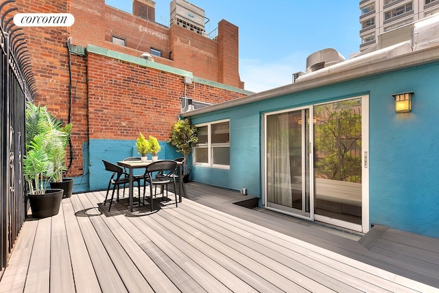 213 E 71st St Unit Ph5, New York City, NY 10021 - wooden deck with outdoor dining space