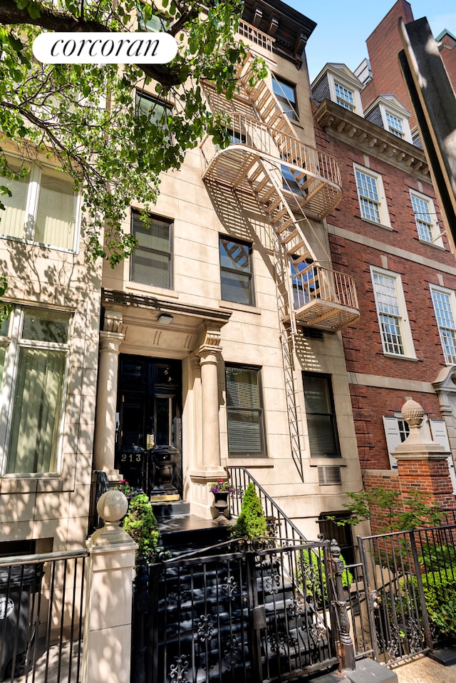 213 E 71st St Unit Ph5, New York City, NY 10021 - view of front facade featuring a gate