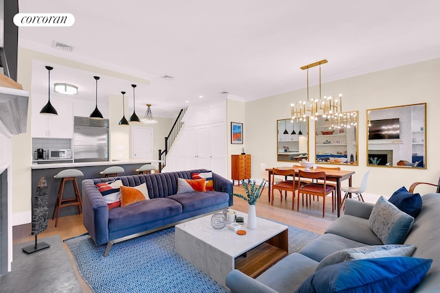 213 E 71st St Unit Ph5, New York City, NY 10021 - living area with stairs, a chandelier, and recessed lighting