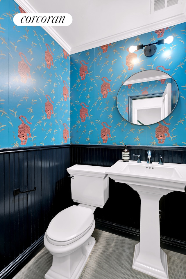 213 E 71st St Unit Ph5, New York City, NY 10021 - half bath with toilet, a wainscoted wall, and ornamental molding
