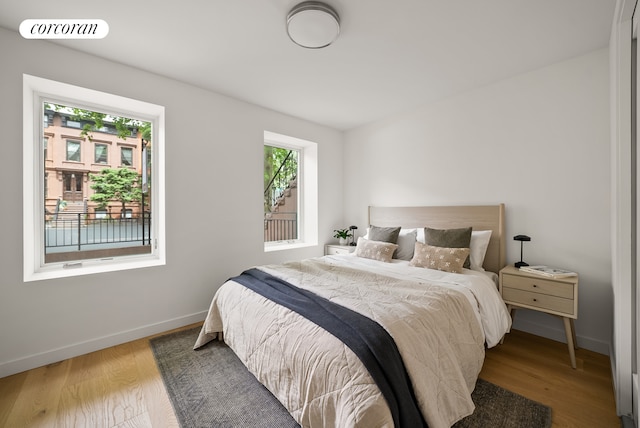 291 6th Ave Unit 1, New York City, NY 11215 - bedroom featuring baseboards and wood finished floors