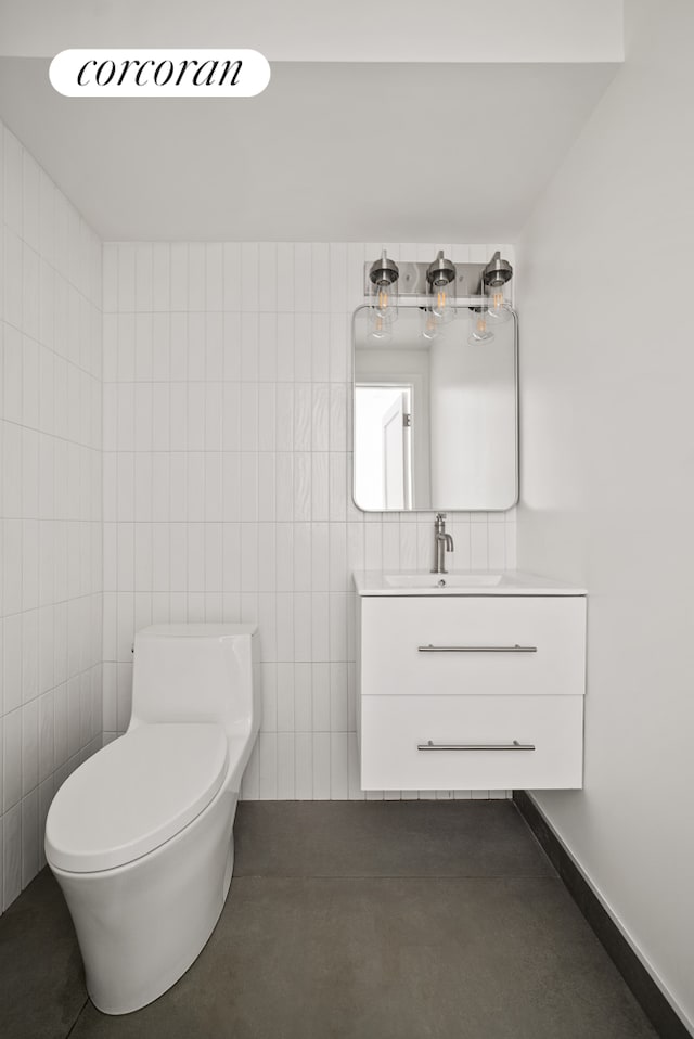 291 6th Ave Unit 1, New York City, NY 11215 - bathroom with vanity and tile walls