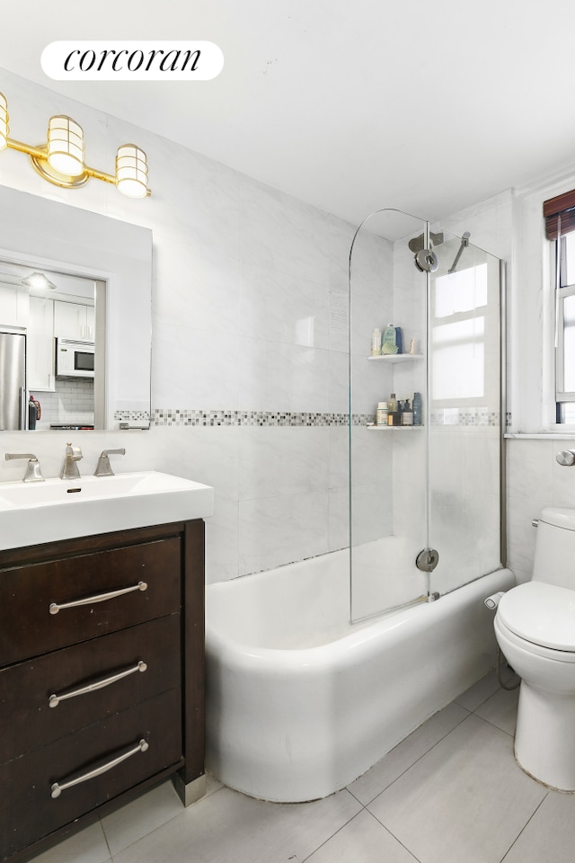 333 E 43rd St Unit 511, New York City, NY 10017 - full bath featuring vanity, tile patterned flooring, and shower / tub combination