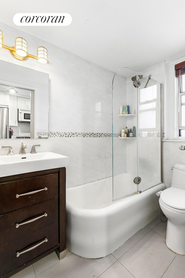 333 E 43rd St Unit 511, New York City, NY 10017 - bathroom with vanity, tile patterned flooring, and bathtub / shower combination