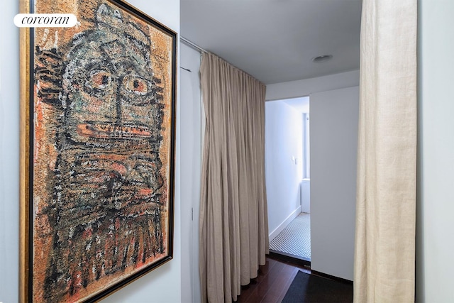 240 E 24th St Unit 4B, New York City, NY 10010 - hall with dark wood-style floors and baseboards