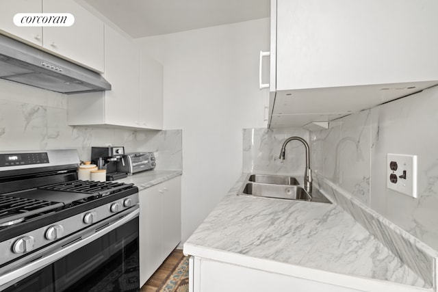 46-12 161st St Unit 3B, New York City, NY 11358 - kitchen featuring gas stove, a sink, extractor fan, backsplash, and white cabinets