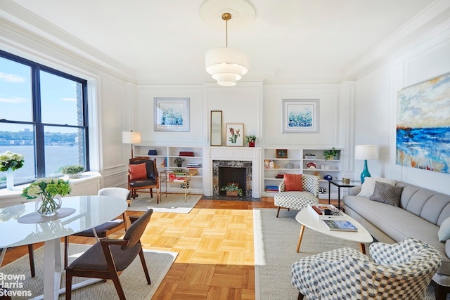 210 Riverside Dr Unit 10F, New York City, NY 10025 - living room featuring a decorative wall, healthy amount of natural light, ornamental molding, and a premium fireplace