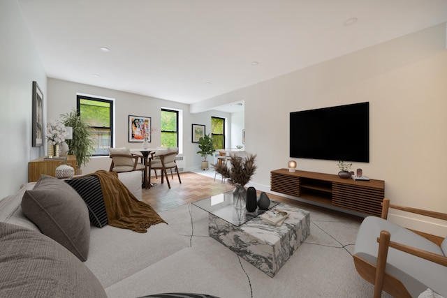41-12 41st St Unit 2N, New York City, NY 11104 - living room featuring baseboards and radiator heating unit