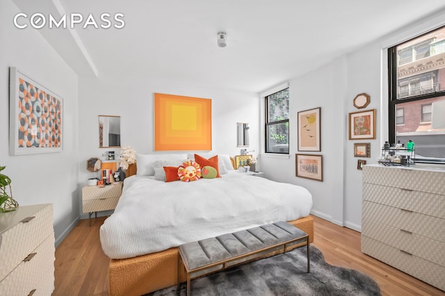 140 W 58th St Pha, Pha, New York City, NY 10019 - bedroom featuring light wood-type flooring and baseboards