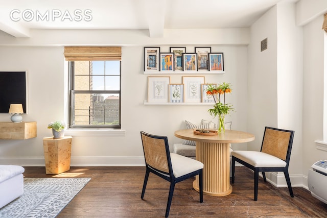 200 E 16th St Unit 14C, New York City, NY 10003 - dining space featuring dark wood finished floors, baseboards, and beamed ceiling