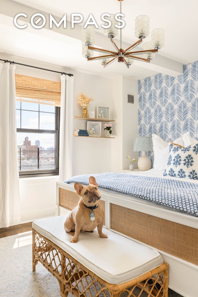 200 E 16th St Unit 14C, New York City, NY 10003 - bedroom with a chandelier and wood finished floors