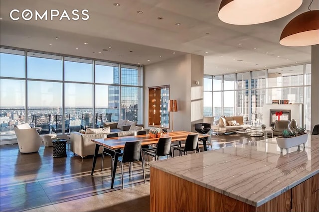 75 Wall St Unit 27F, New York City, NY 10005 - lobby featuring floor to ceiling windows, a high ceiling, and recessed lighting