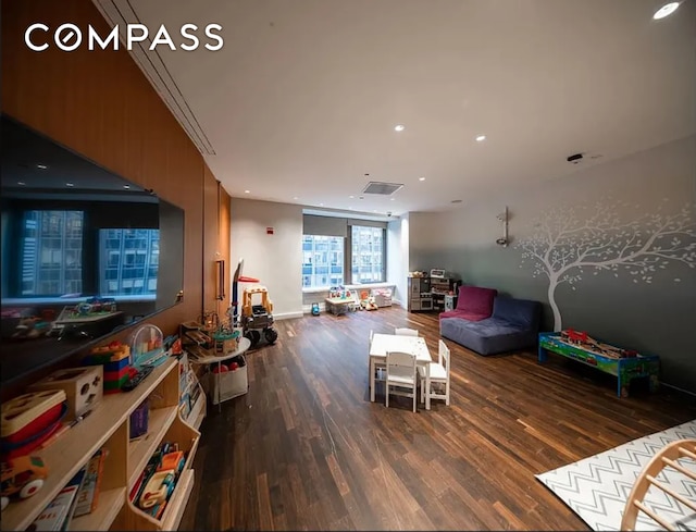 75 Wall St Unit 27F, New York City, NY 10005 - playroom featuring wood finished floors and recessed lighting