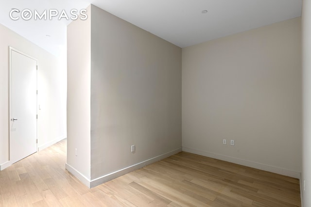 75 Wall St Unit 27F, New York City, NY 10005 - spare room with light wood finished floors and baseboards