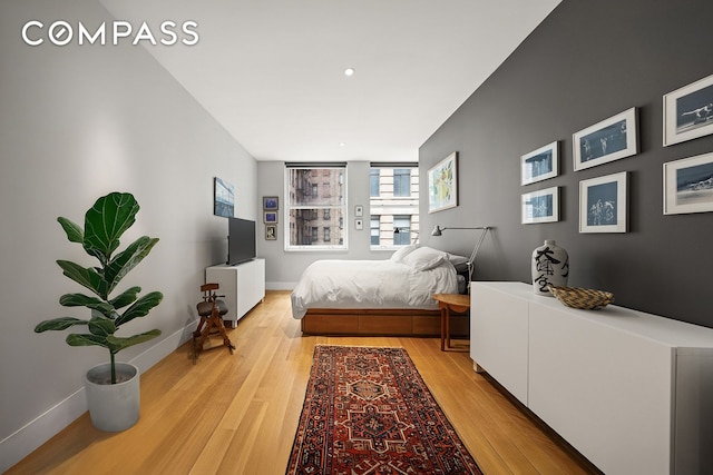 42 Ann St Unit 7, New York City, NY 10038 - bedroom featuring light wood-type flooring and baseboards