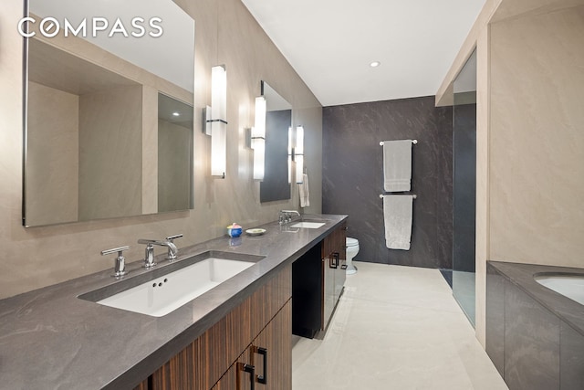 42 Ann St Unit 7, New York City, NY 10038 - full bath featuring double vanity, a tub, tile walls, tile patterned flooring, and recessed lighting