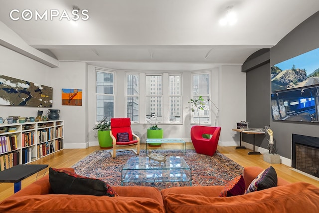 42 Ann St Unit 7, New York City, NY 10038 - living area with wood finished floors, baseboards, healthy amount of natural light, and a fireplace