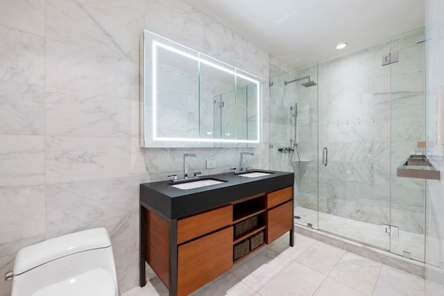 75 Wall St Unit 21N/O, New York City, NY 10005 - bathroom with toilet, double vanity, a marble finish shower, and tile walls