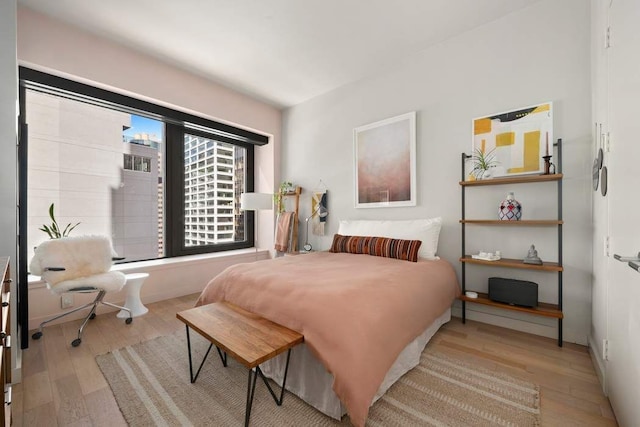 75 Wall St Unit 21N/O, New York City, NY 10005 - bedroom with wood-type flooring
