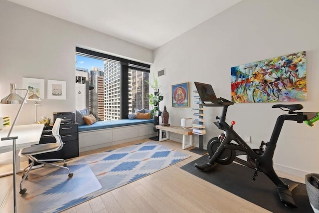 75 Wall St Unit 21N/O, New York City, NY 10005 - exercise room with wood finished floors and baseboards