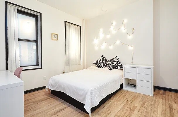 157 W 123rd St Unit 4C, New York City, NY 10027 - bedroom featuring light wood-style floors and baseboards