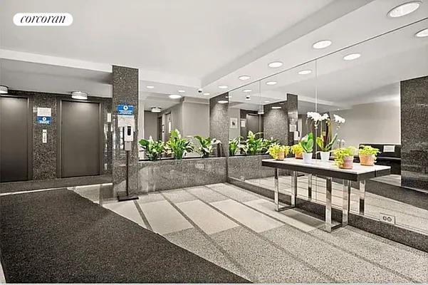 520 E 81st St Unit 8A, New York City, NY 10028 - building lobby featuring recessed lighting