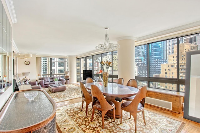 167 E 61st St Unit 11B, New York City, NY 10065 - dining room with ornamental molding, a chandelier, and decorative columns