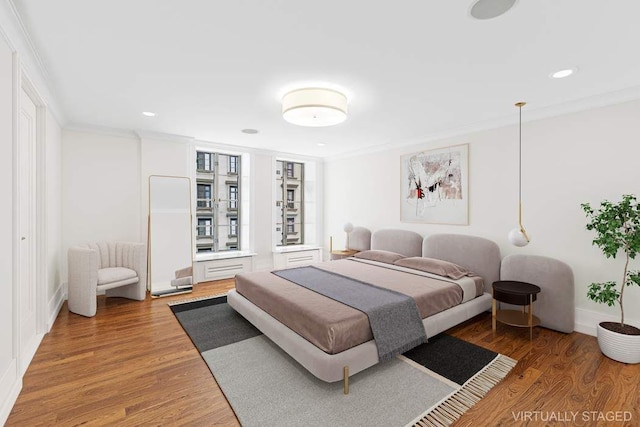 140 E 63rd St Unit 11C, New York City, NY 10065 - bedroom with crown molding, light wood-style floors, baseboards, and recessed lighting