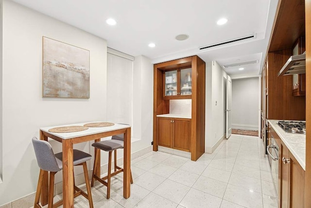 140 E 63rd St Unit 11C, New York City, NY 10065 - dining space featuring recessed lighting, baseboards, and light tile patterned floors
