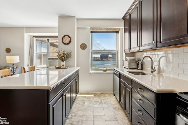 473 Fdr Dr Unit K801, New York City, NY 10002 - kitchen featuring tasteful backsplash, light countertops, stainless steel dishwasher, and healthy amount of natural light