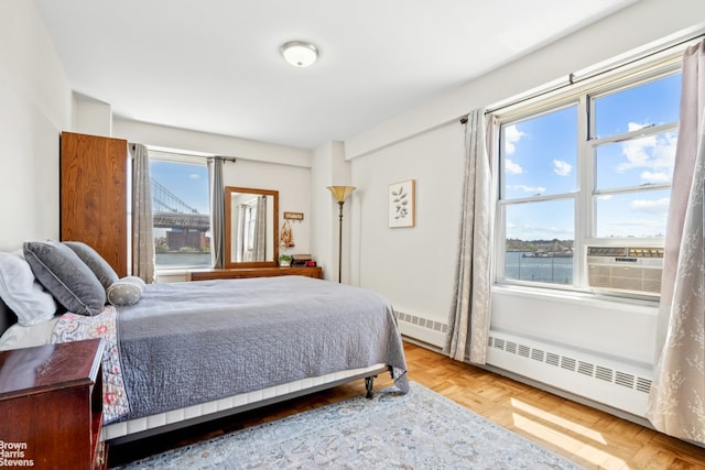 473 Fdr Dr Unit K801, New York City, NY 10002 - bedroom with cooling unit, baseboard heating, and a water view