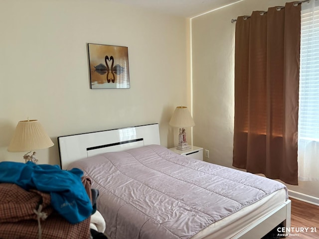 2032 W 4th St, New York City, NY 11223 - bedroom with wood finished floors and baseboards
