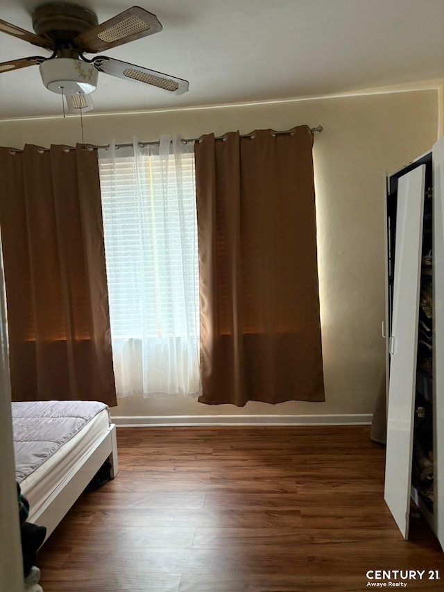 2032 W 4th St, New York City, NY 11223 - unfurnished bedroom featuring wood finished floors and a ceiling fan