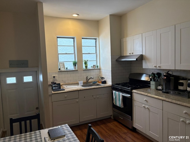 2032 W 4th St, New York City, NY 11223 - kitchen with stainless steel gas range oven, under cabinet range hood, a sink, tasteful backsplash, and dark wood-style floors