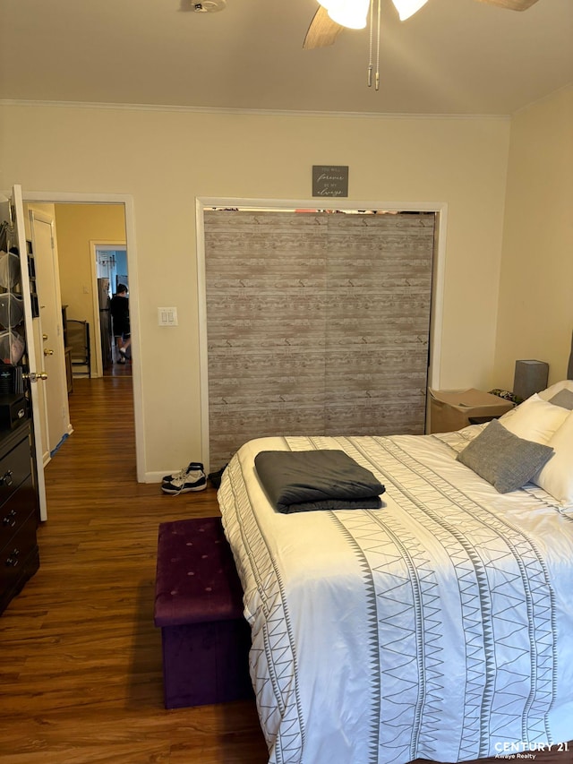 2032 W 4th St, New York City, NY 11223 - bedroom with wood finished floors, a ceiling fan, and baseboards