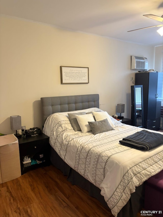 2032 W 4th St, New York City, NY 11223 - bedroom with an AC wall unit, wood finished floors, ornamental molding, and ceiling fan