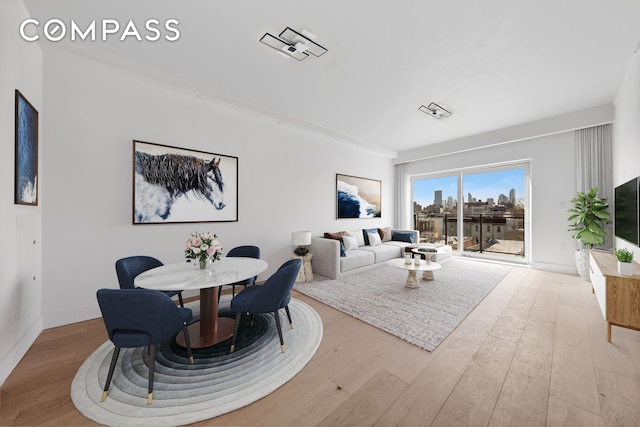 12-16 30th Ave Unit 305, New York City, NY 11102 - dining area featuring wood finished floors