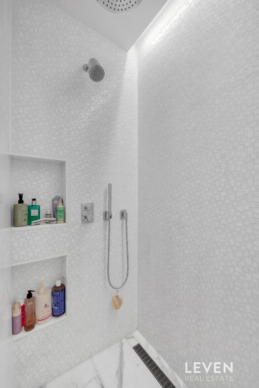 30 Riverside Blvd Unit 22F, New York City, NY 10069 - bathroom with a tile shower and marble finish floors