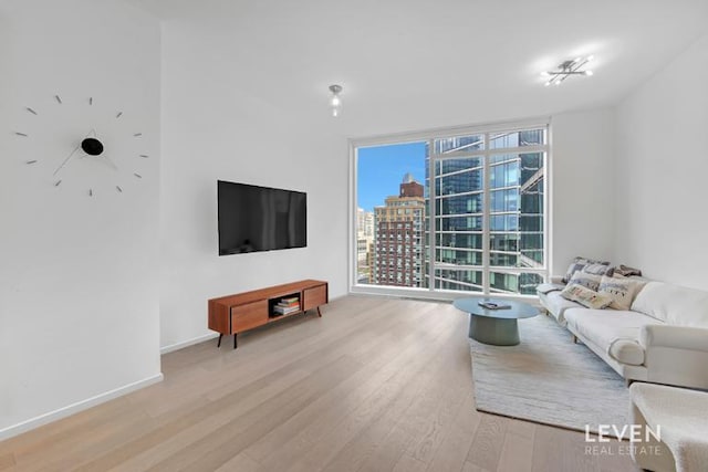 30 Riverside Blvd Unit 22F, New York City, NY 10069 - living area with floor to ceiling windows and light wood-type flooring