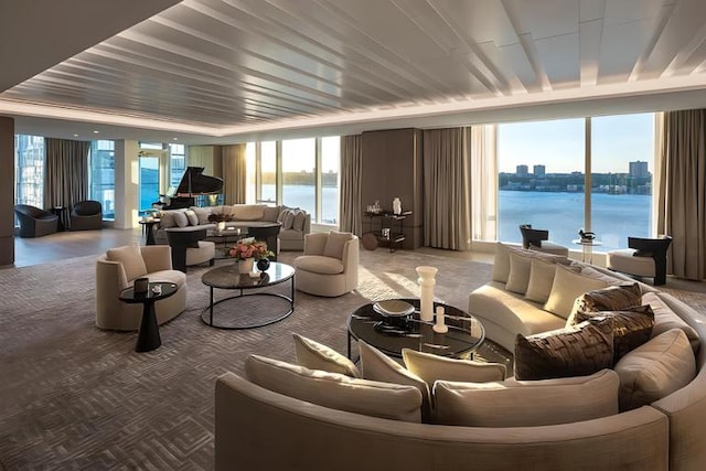 30 Riverside Blvd Unit 22F, New York City, NY 10069 - living room featuring a water view, carpet, plenty of natural light, and expansive windows