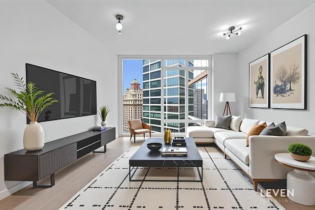 30 Riverside Blvd Unit 22F, New York City, NY 10069 - living area featuring a wall of windows, a city view, and wood finished floors