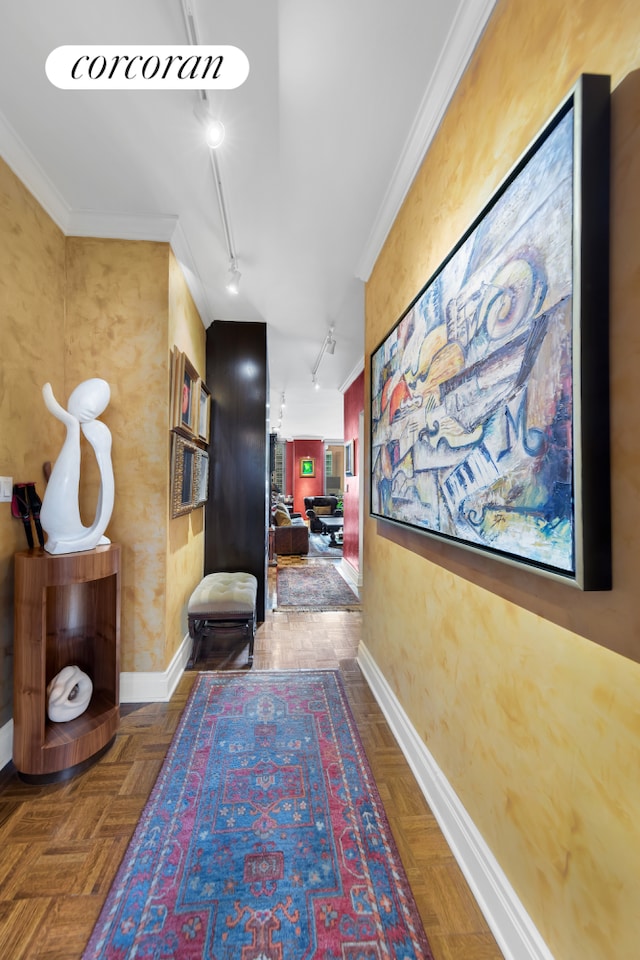 400 E 90th St Unit 8F, New York City, NY 10128 - corridor featuring rail lighting, baseboards, ornamental molding, and attic access