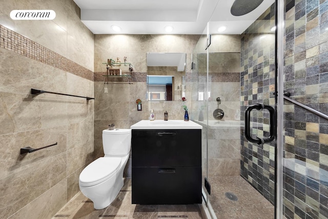 400 E 90th St Unit 8F, New York City, NY 10128 - bathroom featuring tile walls, vanity, a stall shower, and toilet