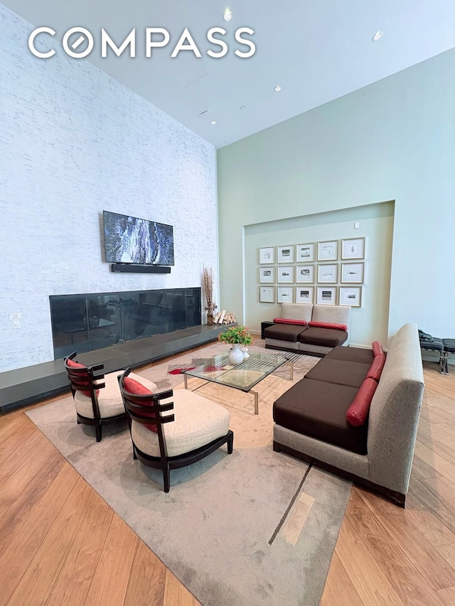 325 5th Ave Unit 14E, New York City, NY 10016 - living area featuring wood finished floors and a towering ceiling