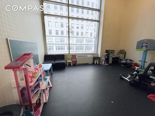 325 5th Ave Unit 14E, New York City, NY 10016 - game room with wallpapered walls and rubber floors