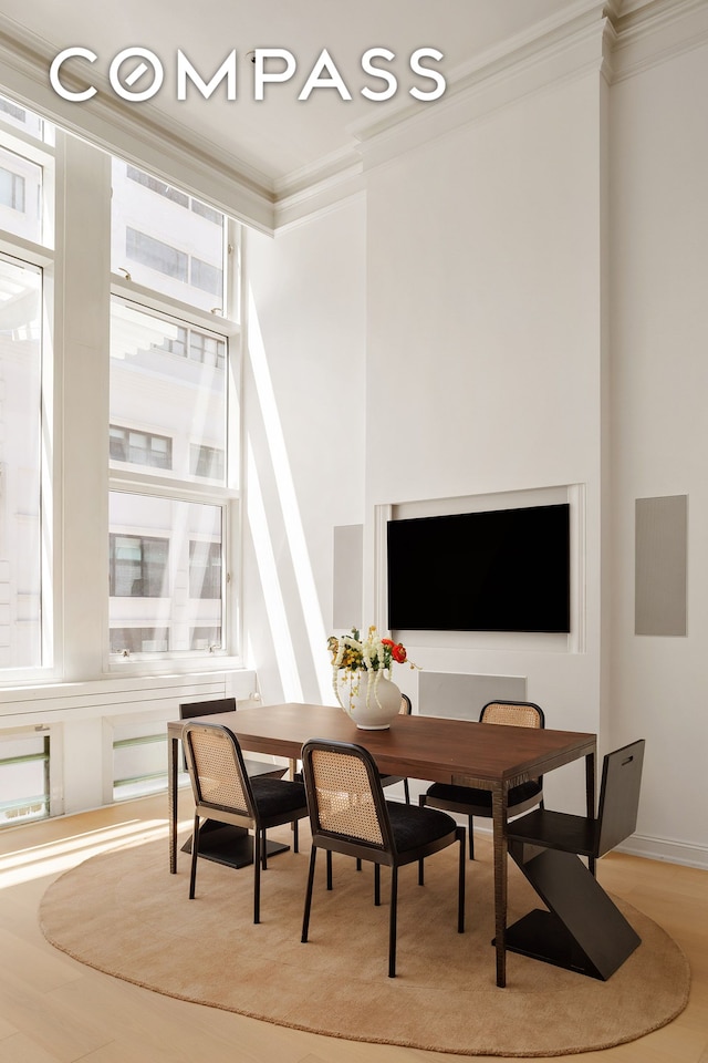 16 Warren St Unit 5, New York City, NY 10007 - dining space with ornamental molding and light wood-style floors