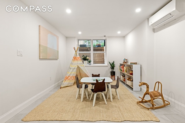 744 Park Pl Unit 1A, New York City, NY 11216 - playroom with a wall mounted AC, recessed lighting, and baseboards