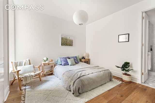744 Park Pl Unit 1A, New York City, NY 11216 - bedroom featuring wood finished floors and baseboards
